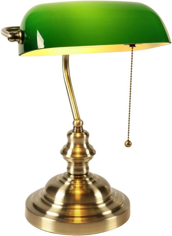 OBright antique brass pharmacy desk lamp glowing on a styled gold home office desk