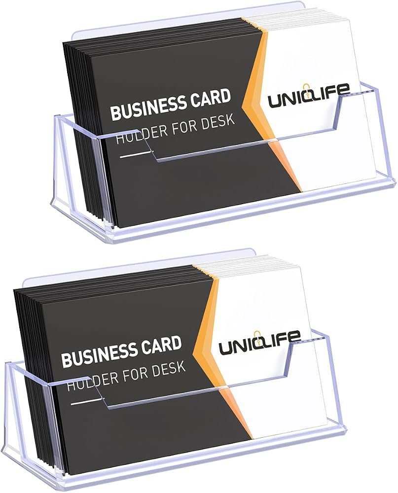GoCraft solid brass business card holder on a white and gold home office desk