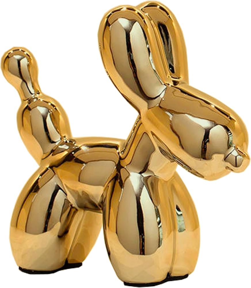 WhimWove metallic gold balloon dog figurine on a styled white and gold office desk