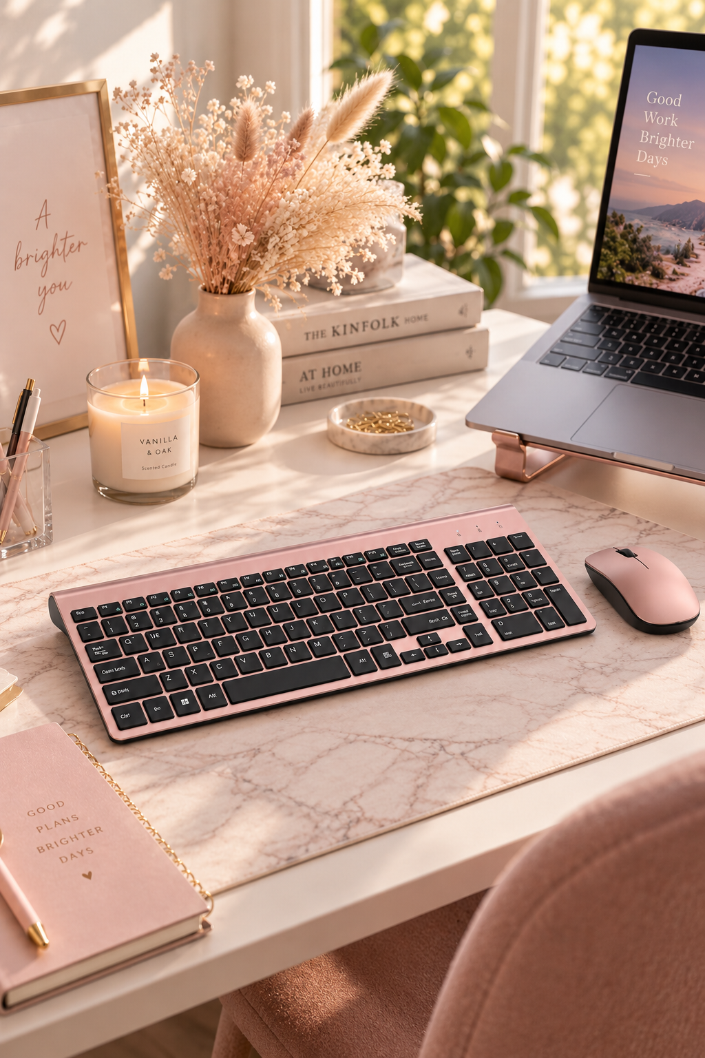 Rose gold and black wireless keyboard and mouse combo on a blush desk setup